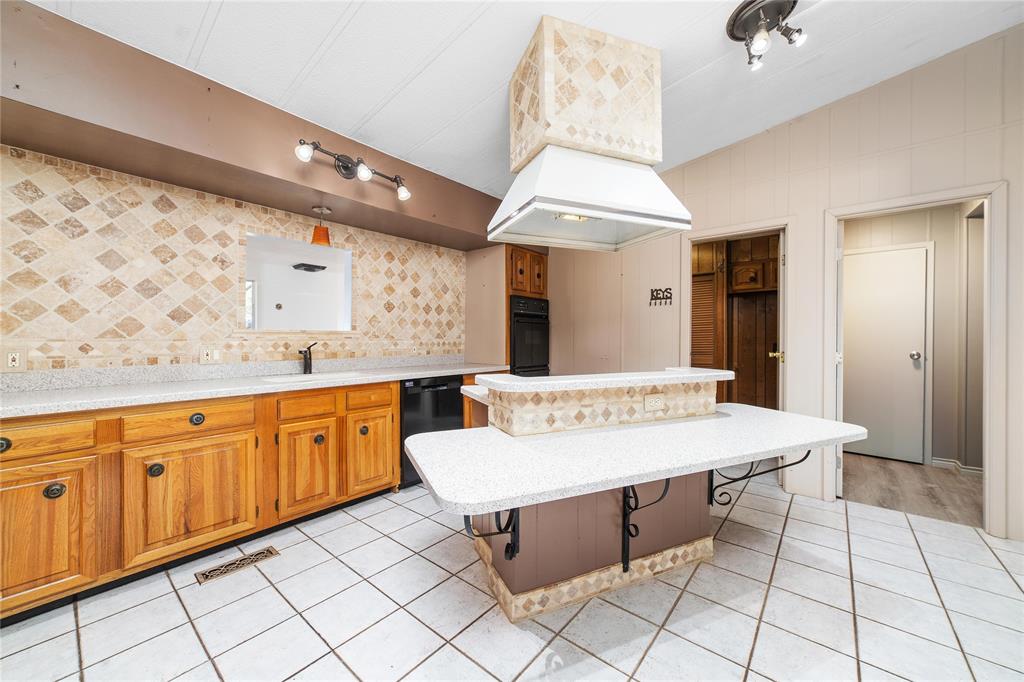 13601 Highway 377 Brookesmith, TX 76827 - Photo 8 of 35 a room with granite countertop furniture and a chandelier