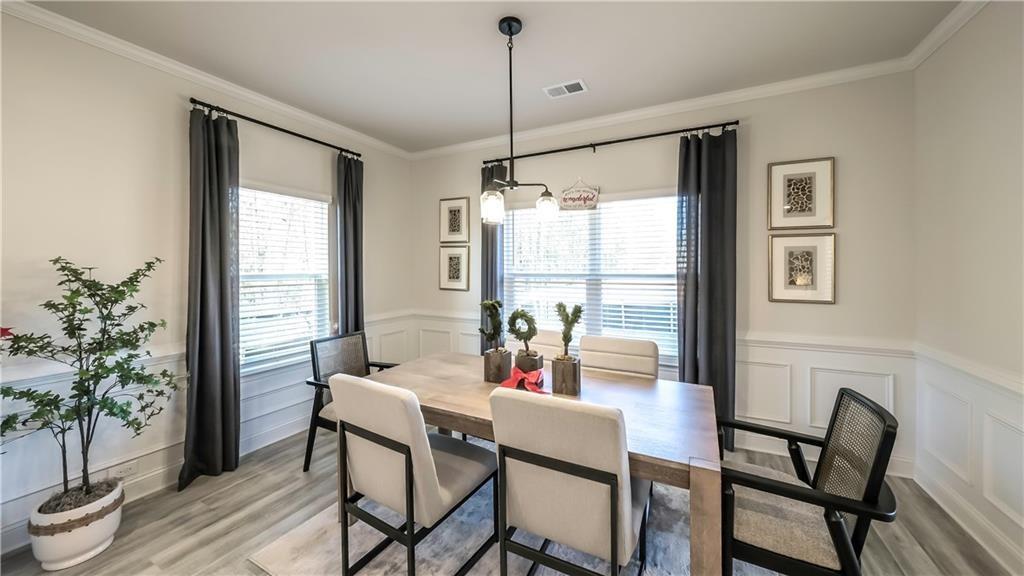 213 Laney Drive Carrollton, GA 30117 - Photo 12 of 36 a view of a dining room with furniture window and wooden floor
