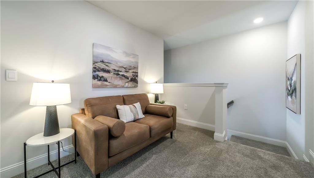 213 Laney Drive Carrollton, GA 30117 - Photo 13 of 36 a living room with furniture and a lamp