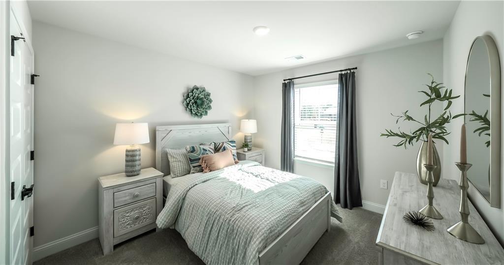 213 Laney Drive Carrollton, GA 30117 - Photo 18 of 36 a bedroom with a bed and a window