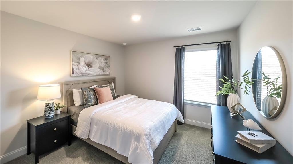 213 Laney Drive Carrollton, GA 30117 - Photo 20 of 36 a bedroom with a bed and a window