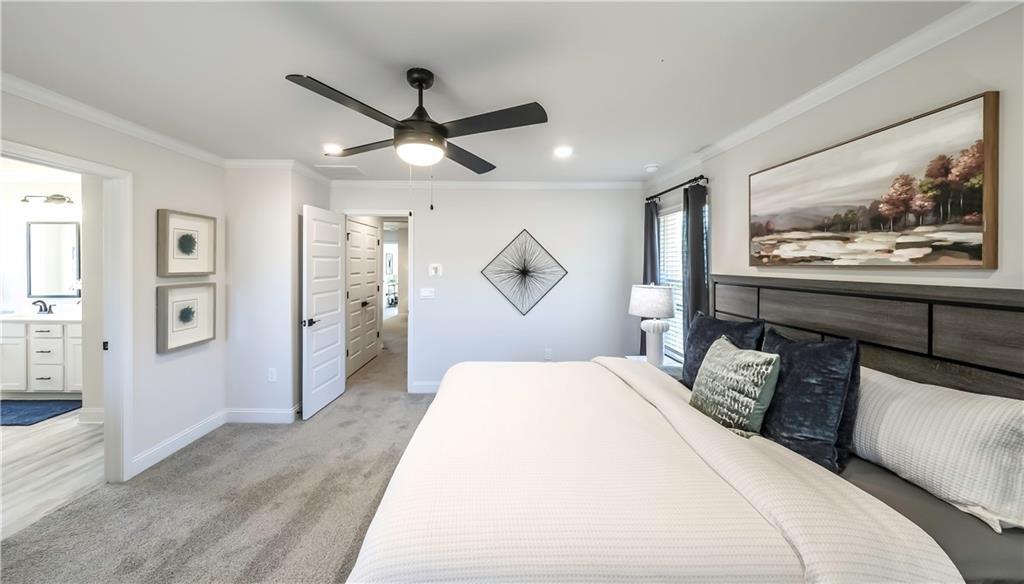 213 Laney Drive Carrollton, GA 30117 - Photo 25 of 36 a bedroom with a large bed and a large window