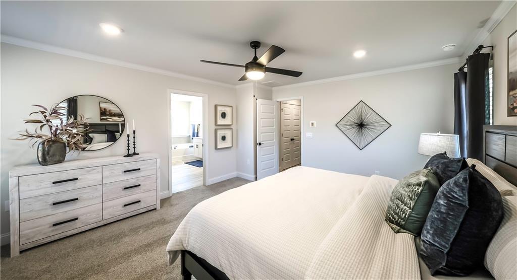 213 Laney Drive Carrollton, GA 30117 - Photo 29 of 36 a spacious bedroom with a bed and a dresser