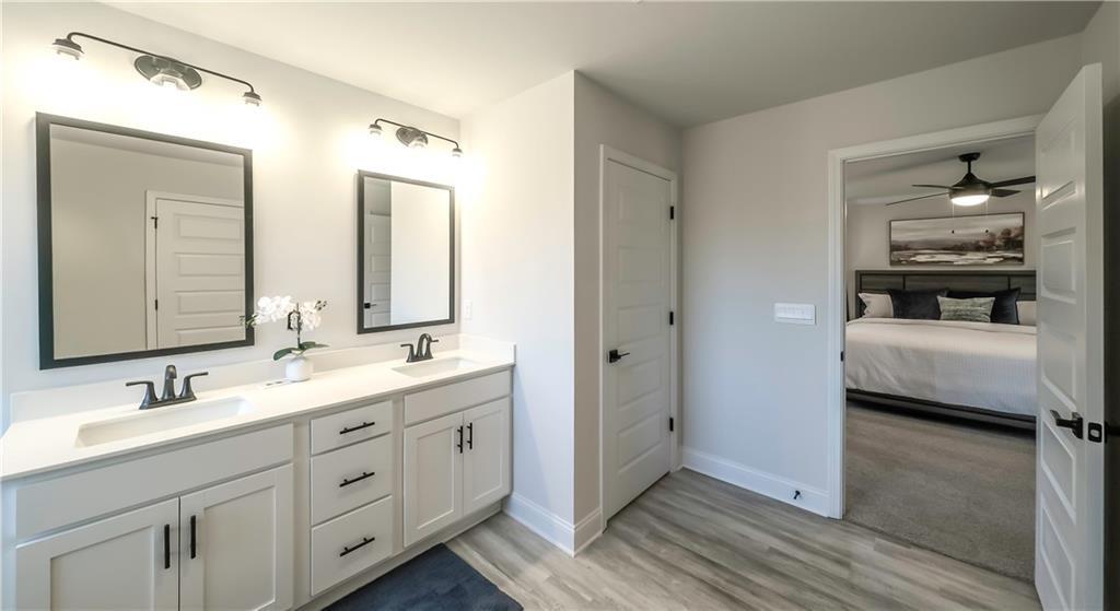 213 Laney Drive Carrollton, GA 30117 - Photo 33 of 36 a en suite bathroom with 2 sink and a mirror