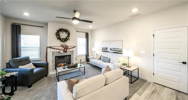 a living room with furniture and a fireplace