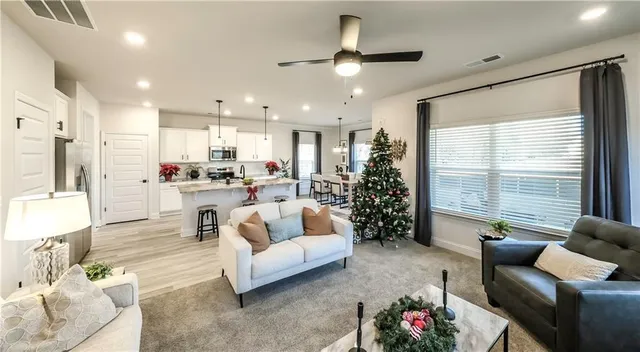 a living room with furniture and a large window