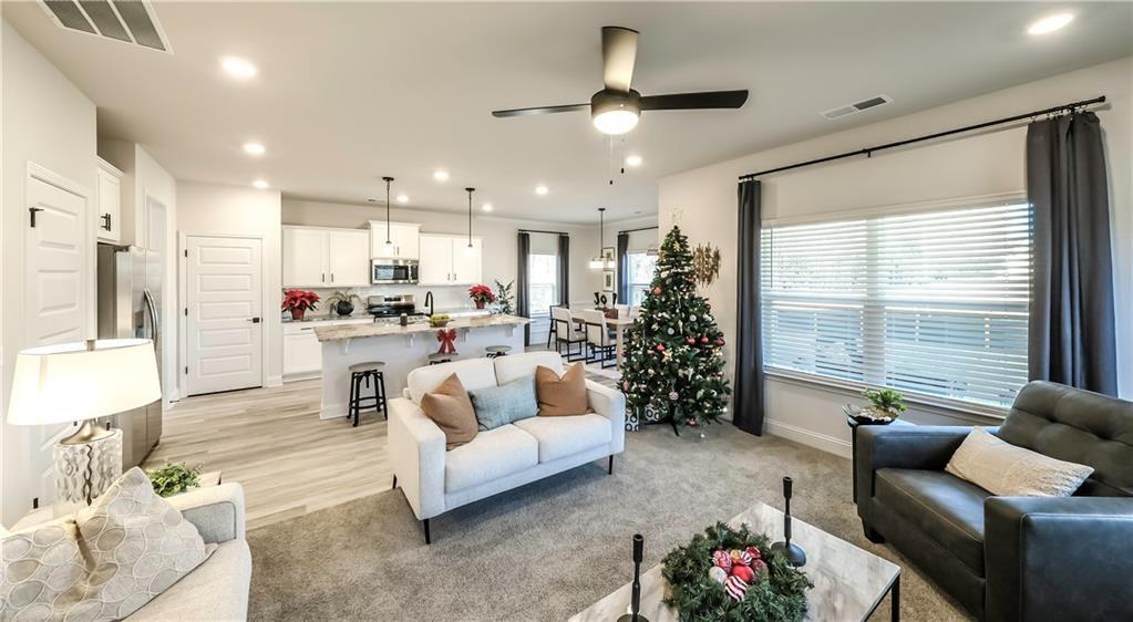 213 Laney Drive Carrollton, GA 30117 - Photo 9 of 36 a living room with furniture and a large window