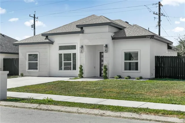 a front view of a house and a yard