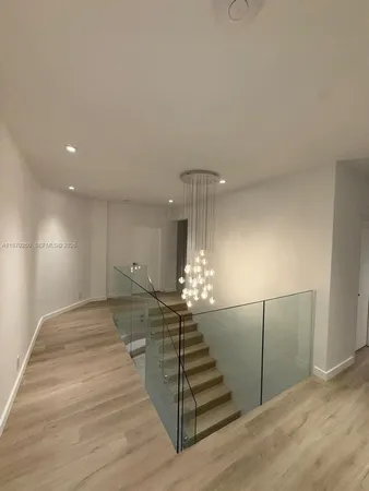 a view of a livingroom with stairs and furniture