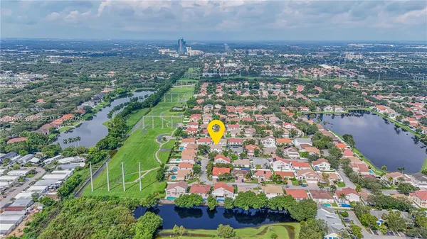 an aerial view of residential building and lake