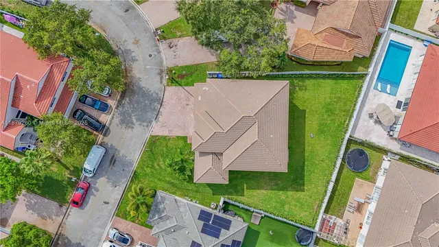 an aerial view of house with a yard