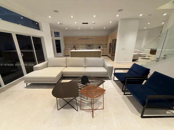 a living room with furniture and a rug