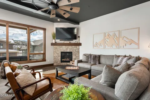 a living room with furniture and a fireplace