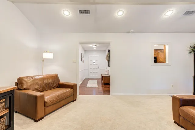 a bedroom with furniture and a window