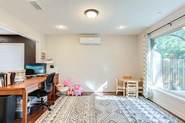 a kitchen with a table and chairs in it