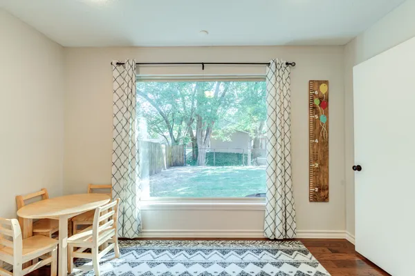 a large kitchen with stainless steel appliances granite countertop a refrigerator and a stove