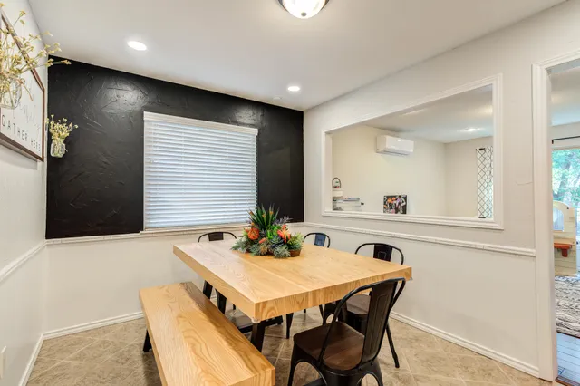 a kitchen with granite countertop a sink and a refrigerator