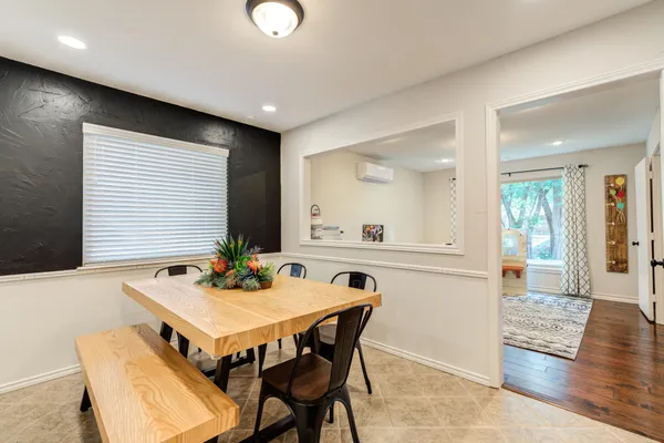 a kitchen with stainless steel appliances granite countertop lots of counter top space and wooden floor