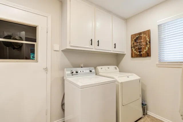 a bedroom with a bed and a ceiling fan