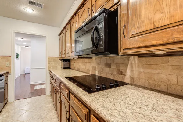 a bathroom with a sink vanity and mirror