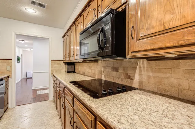 a bathroom with a sink vanity and mirror
