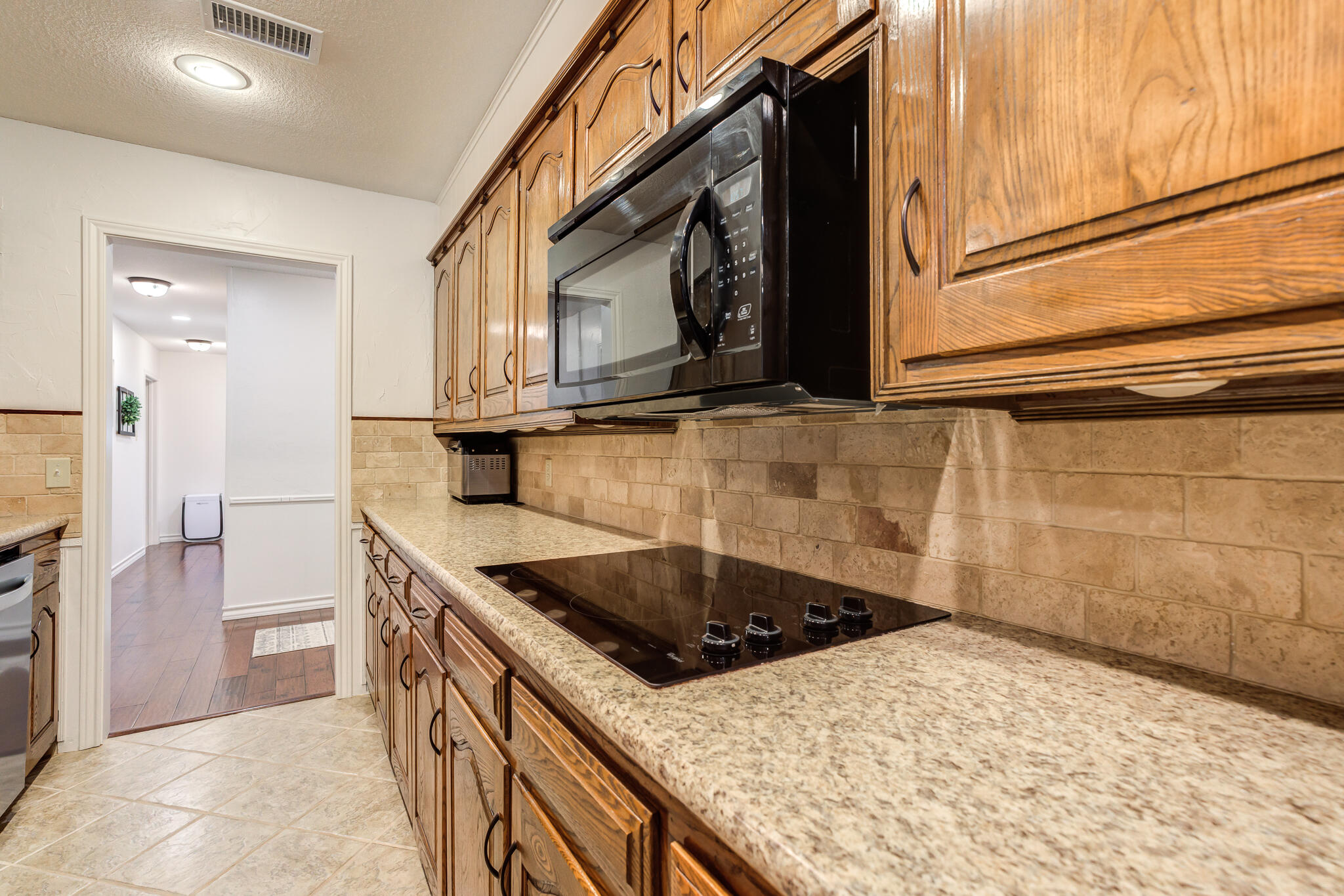 5 West Brookhollow Ransom Canyon, TX 79366 - Photo 35 of 62 a kitchen that has a sink and a stove