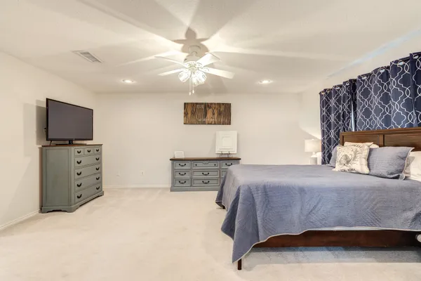 a bathroom with a toilet and a window