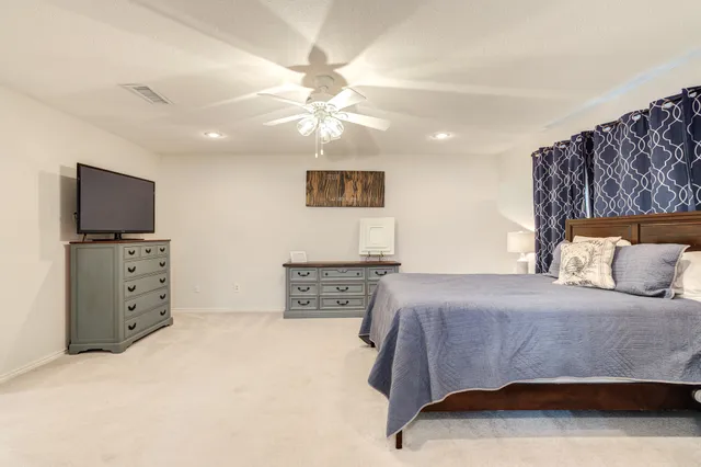a bathroom with a toilet and a window