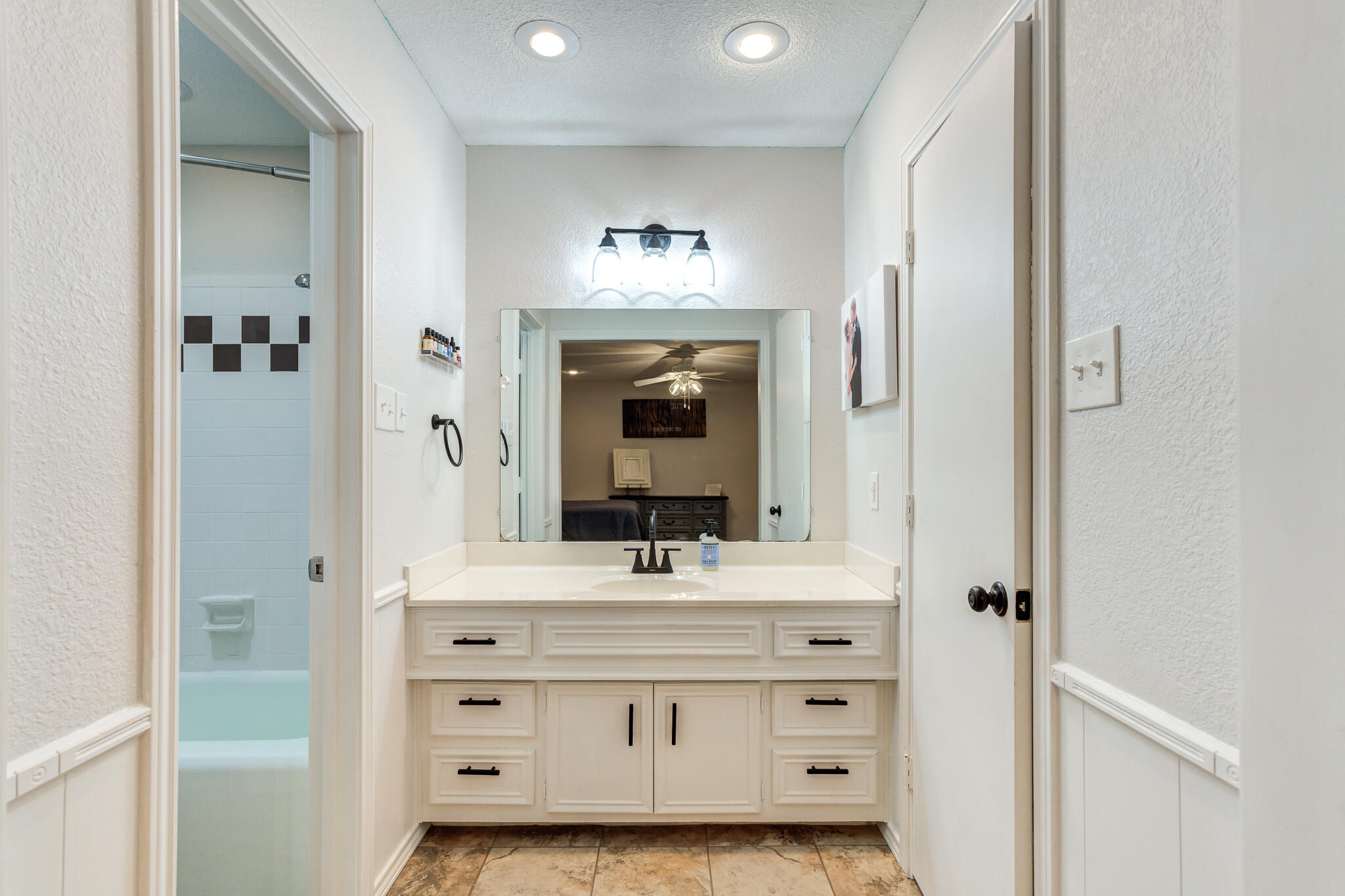 5 West Brookhollow Ransom Canyon, TX 79366 - Photo 43 of 62 a bathroom with a sink vanity and mirror