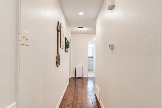 a view of a backyard with a slide and a child swing