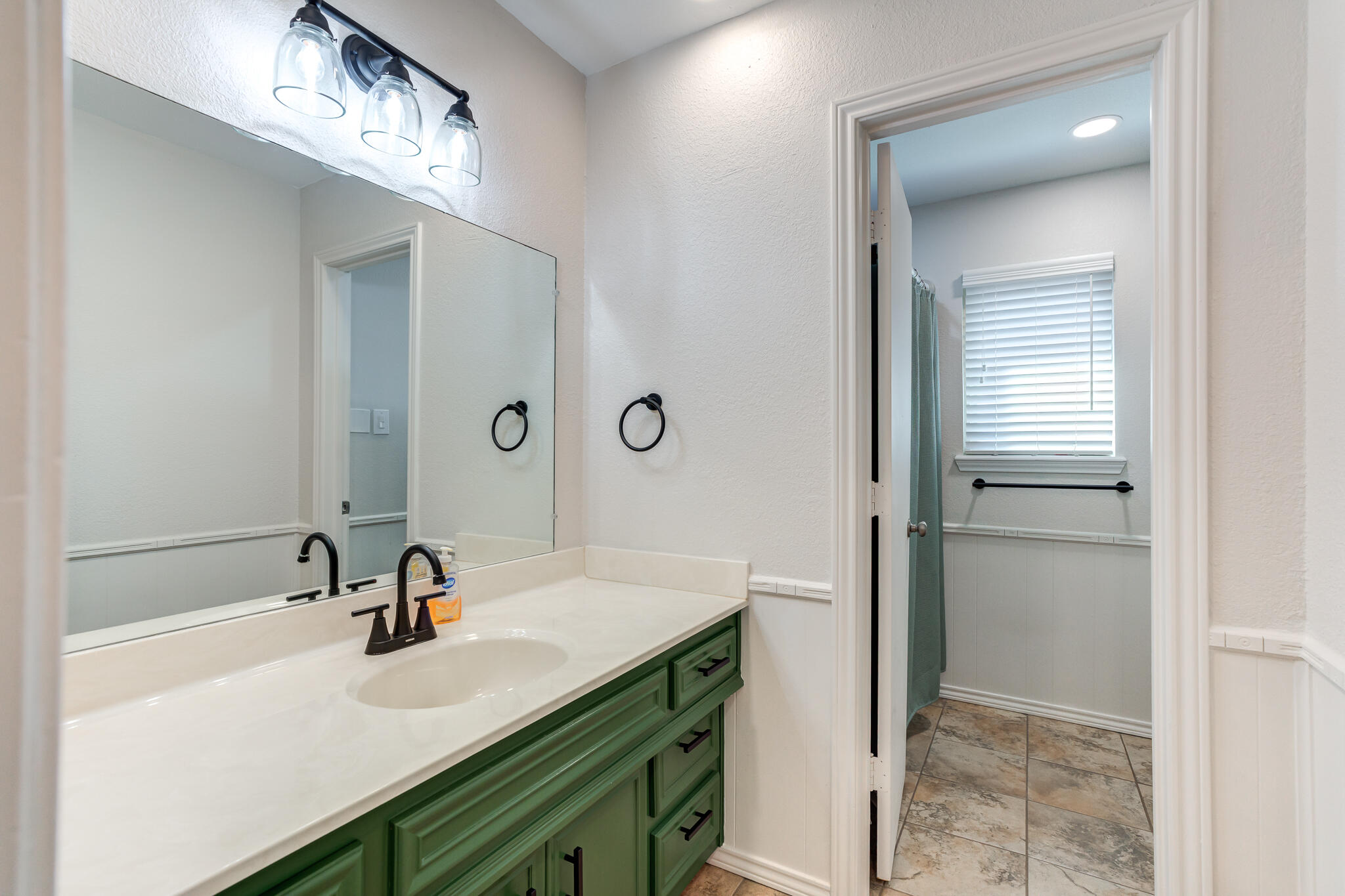 5 West Brookhollow Ransom Canyon, TX 79366 - Photo 50 of 62 a bathroom with a sink and a mirror