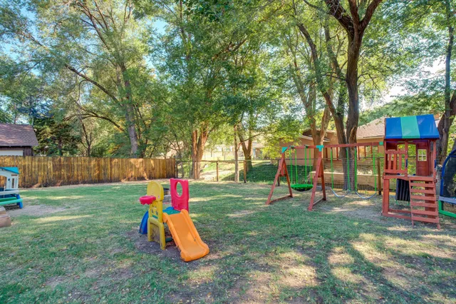 a backyard of a house with lots of green space