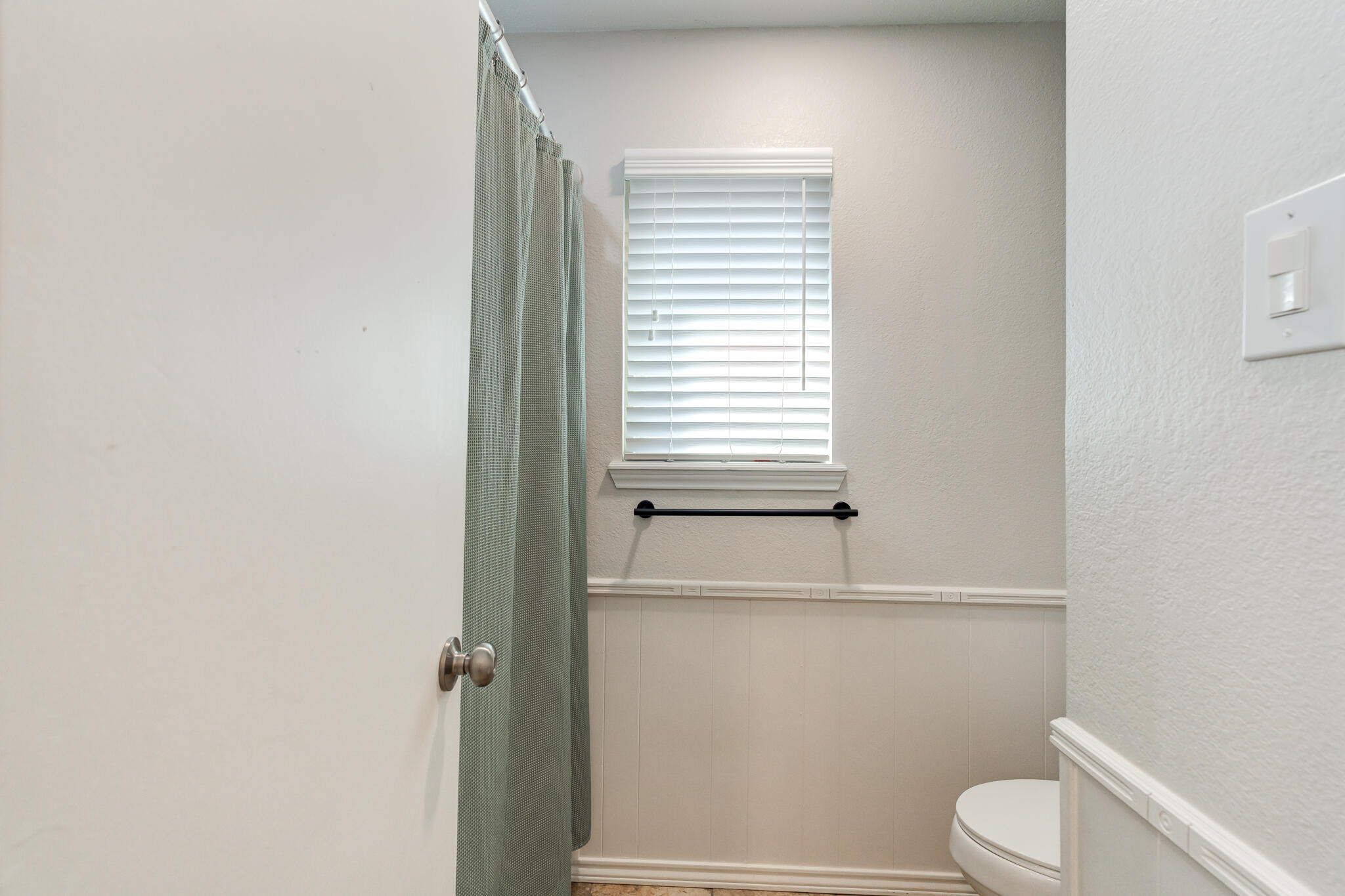 5 West Brookhollow Ransom Canyon, TX 79366 - Photo 51 of 62 a bathroom with a toilet and a window