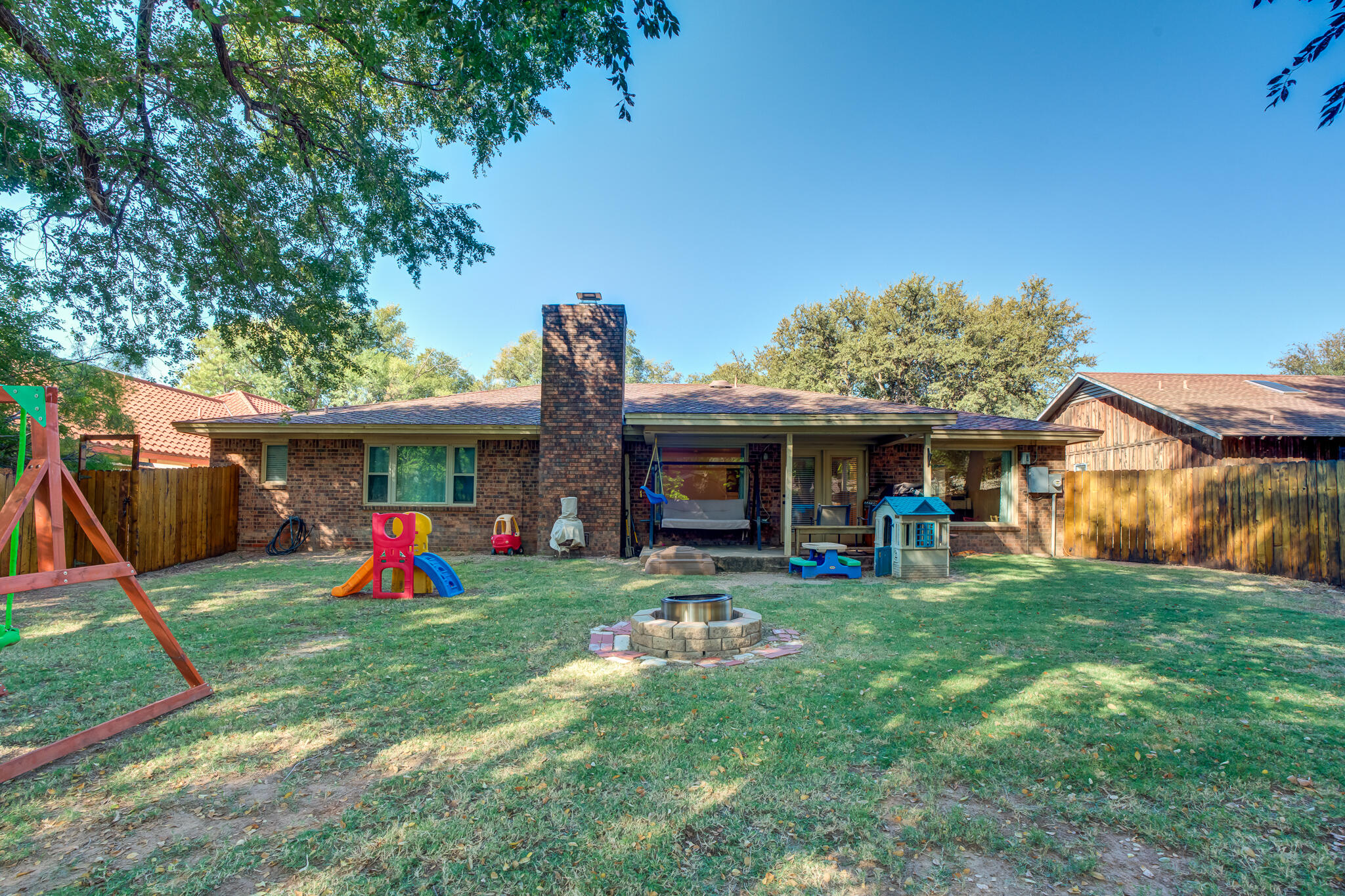 5 West Brookhollow Ransom Canyon, TX 79366 - Photo 58 of 62 a view of a house with a yard and sitting area