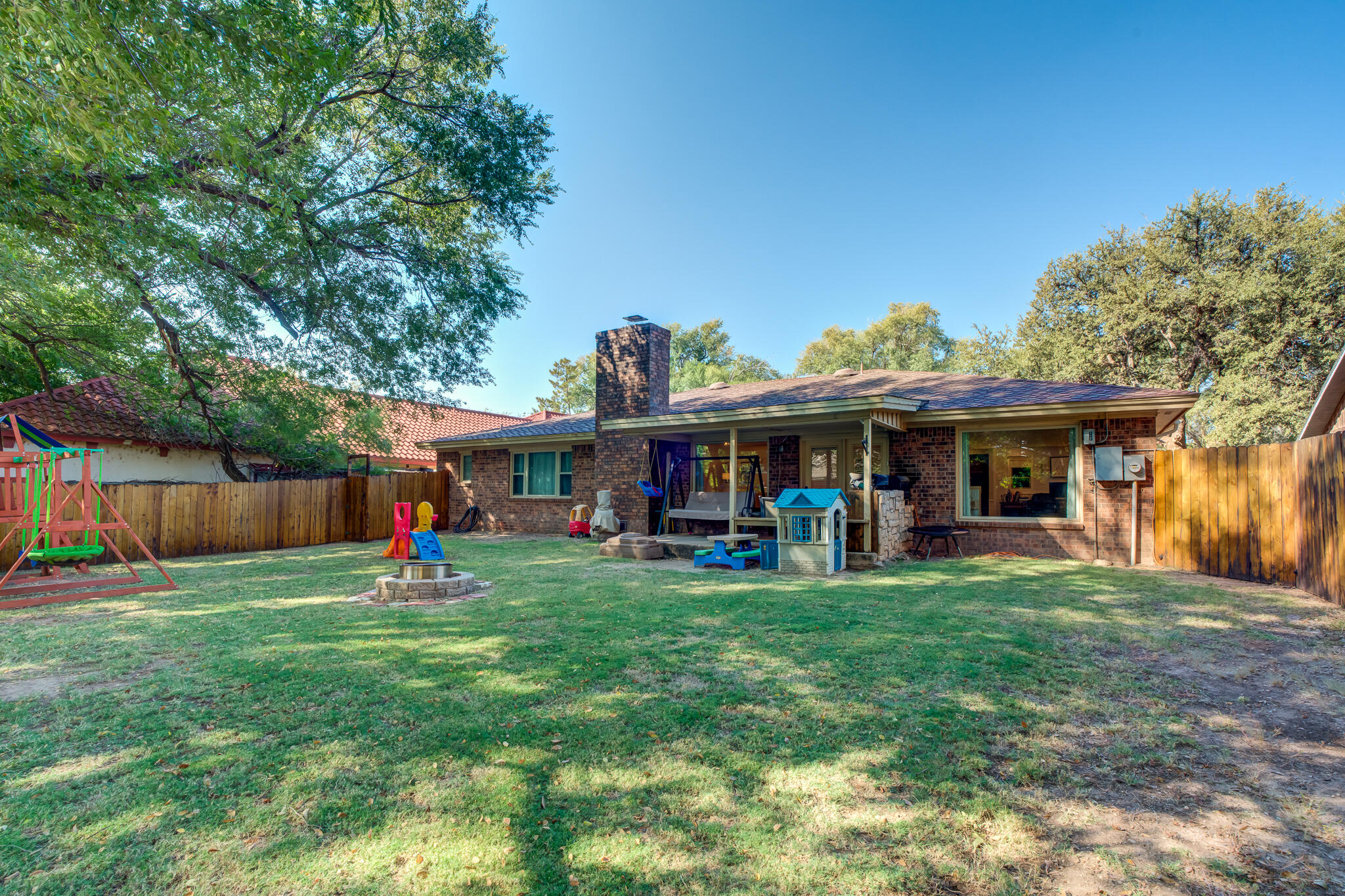 5 West Brookhollow Ransom Canyon, TX 79366 - Photo 6 of 62 a view of a house with a yard and sitting area
