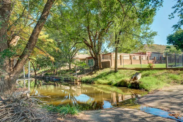 a view of a living room with furniture and a fireplace