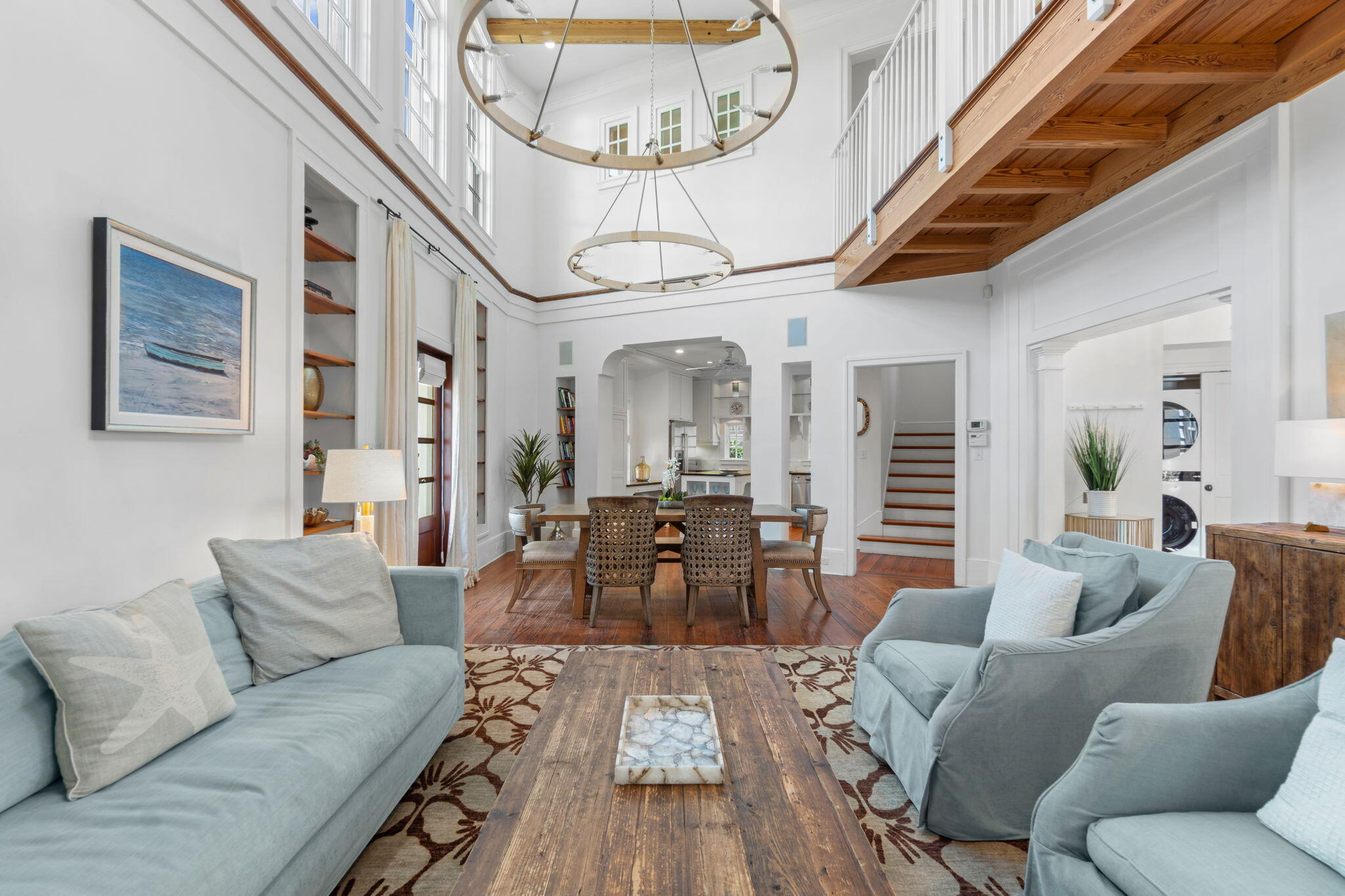 16 South Green Turtle Lane Inlet Beach, FL 32461 - Photo 16 of 59 a living room with furniture a large window and wooden floor