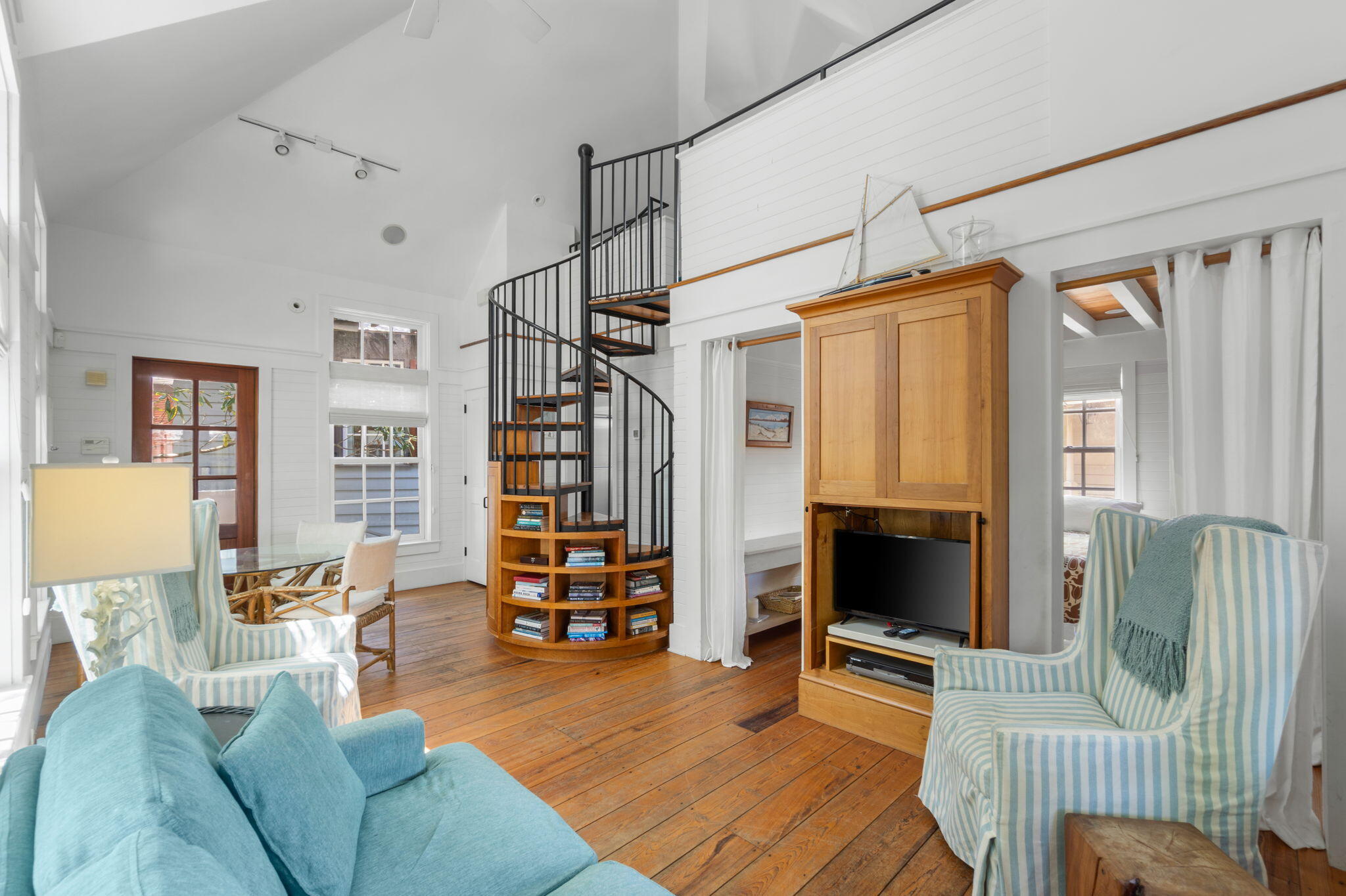 16 South Green Turtle Lane Inlet Beach, FL 32461 - Photo 46 of 59 a living room with furniture a flat screen tv and a large window