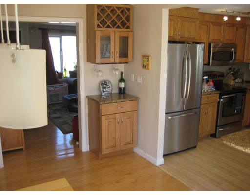 48 Upland Road West Arlington, MA 02474 - Photo 3 of 19 a kitchen with stainless steel appliances a refrigerator and a sink