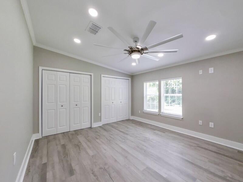 630 West Griffith Avenue Crestview, FL 32536 - Photo 17 of 36 wooden floor in an empty room with a window