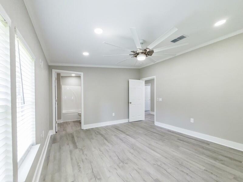 630 West Griffith Avenue Crestview, FL 32536 - Photo 19 of 36 wooden floor in an empty room with a window