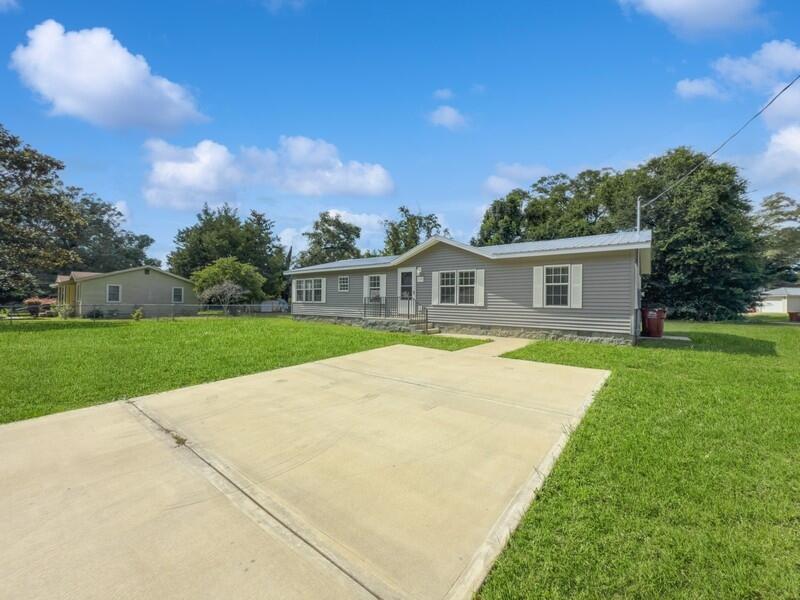 630 West Griffith Avenue Crestview, FL 32536 - Photo 2 of 36 a view of house with yard and swimming pool