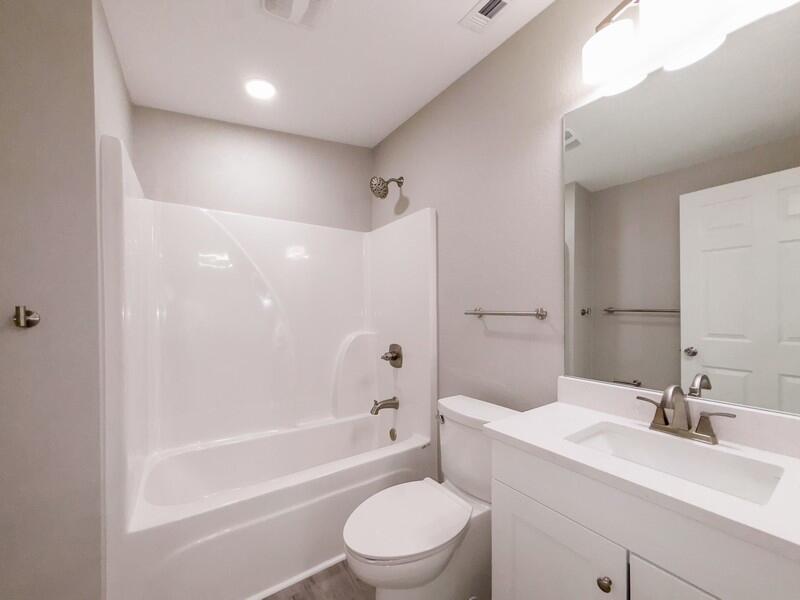 630 West Griffith Avenue Crestview, FL 32536 - Photo 21 of 36 a bathroom with a bathtub shower sink vanity mirror and toilet