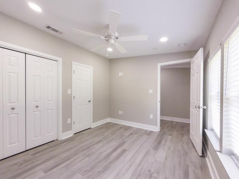 630 West Griffith Avenue Crestview, FL 32536 - Photo 24 of 36 an empty room with wooden floor and windows