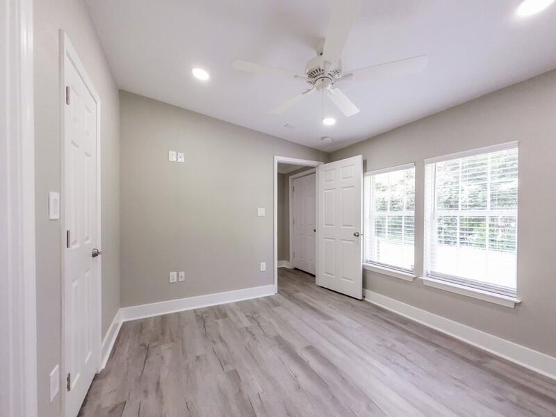 630 West Griffith Avenue Crestview, FL 32536 - Photo 25 of 36 a view of an empty room with wooden floor and a window