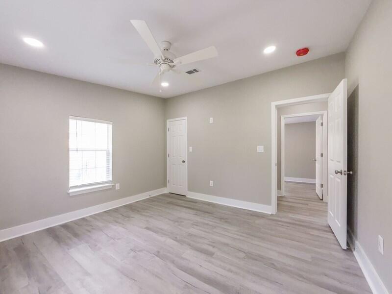 630 West Griffith Avenue Crestview, FL 32536 - Photo 26 of 36 a view of an empty room with wooden floor and a window
