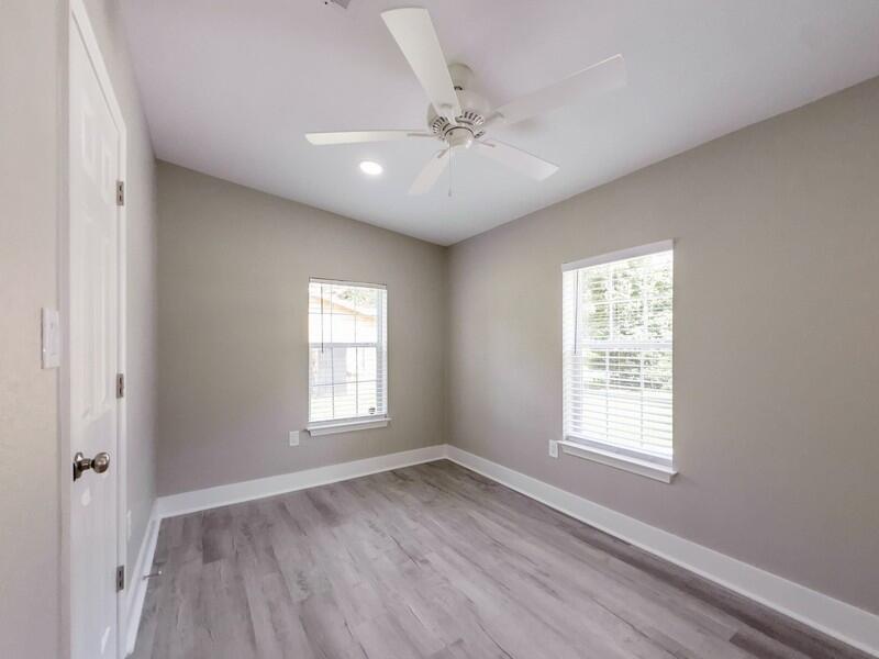 630 West Griffith Avenue Crestview, FL 32536 - Photo 30 of 36 a view of an empty room with a window and wooden floor