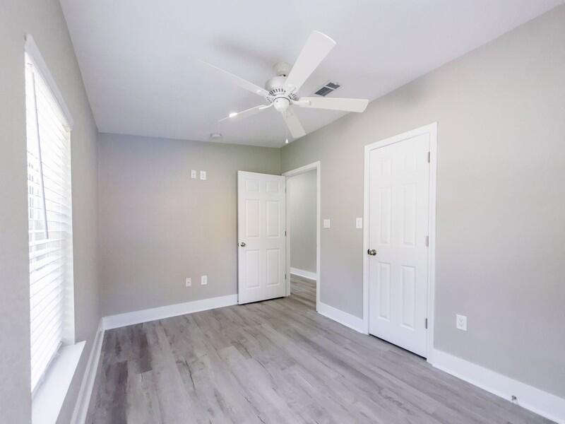 630 West Griffith Avenue Crestview, FL 32536 - Photo 32 of 36 an empty room with wooden floor and windows