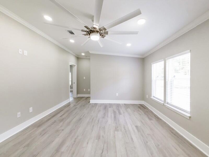 630 West Griffith Avenue Crestview, FL 32536 - Photo 5 of 36 wooden floor in an empty room with a window