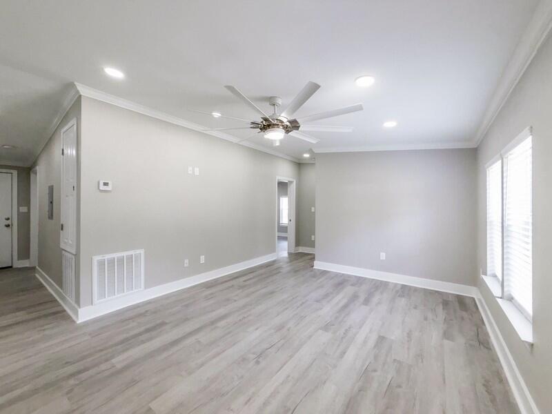 630 West Griffith Avenue Crestview, FL 32536 - Photo 6 of 36 wooden floor in an empty room with a window